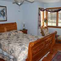 Downstairs guest room with queen bed and connecting bathroom.