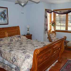 Downstairs guest room with queen bed and connecting bathroom.