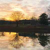 View of the farmhouse across the pond.