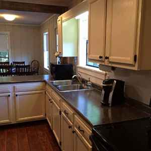 Fully equipped kitchen and a stacked washer/dryer.