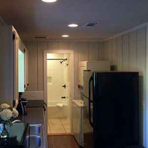 Fully equipped kitchen and a stacked washer/dryer.