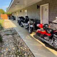 A group riding the parkway on motorcycles.